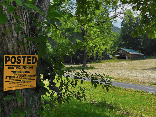 minuteman trespassing sign